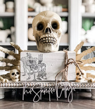 Load image into Gallery viewer, Stamped Book Stack - Sitting Skeleton